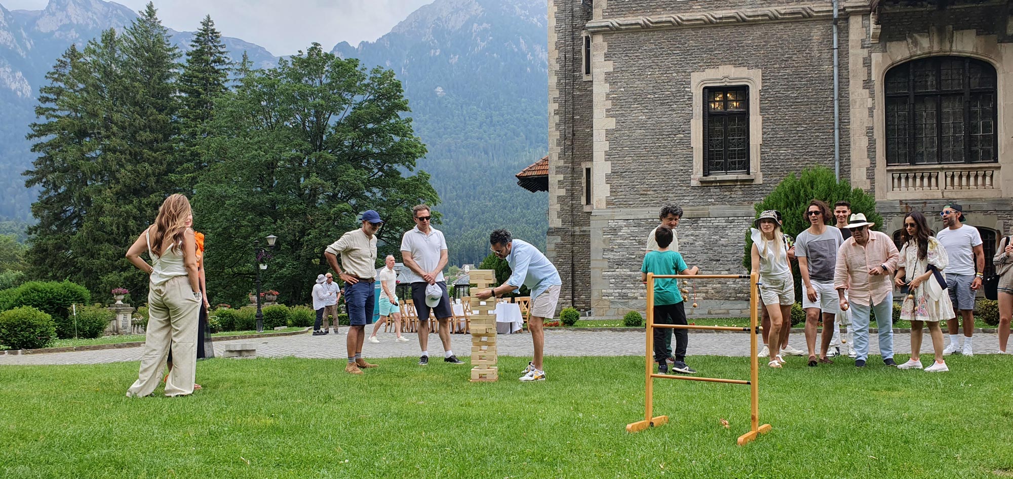 Tourists enjoying Chef de Joc games at cantacuzino Palace Busteni